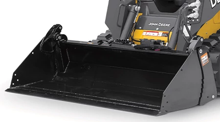 Front left studio view of a black MP series multi-purpose bucket resting on the ground in front of attached track loader