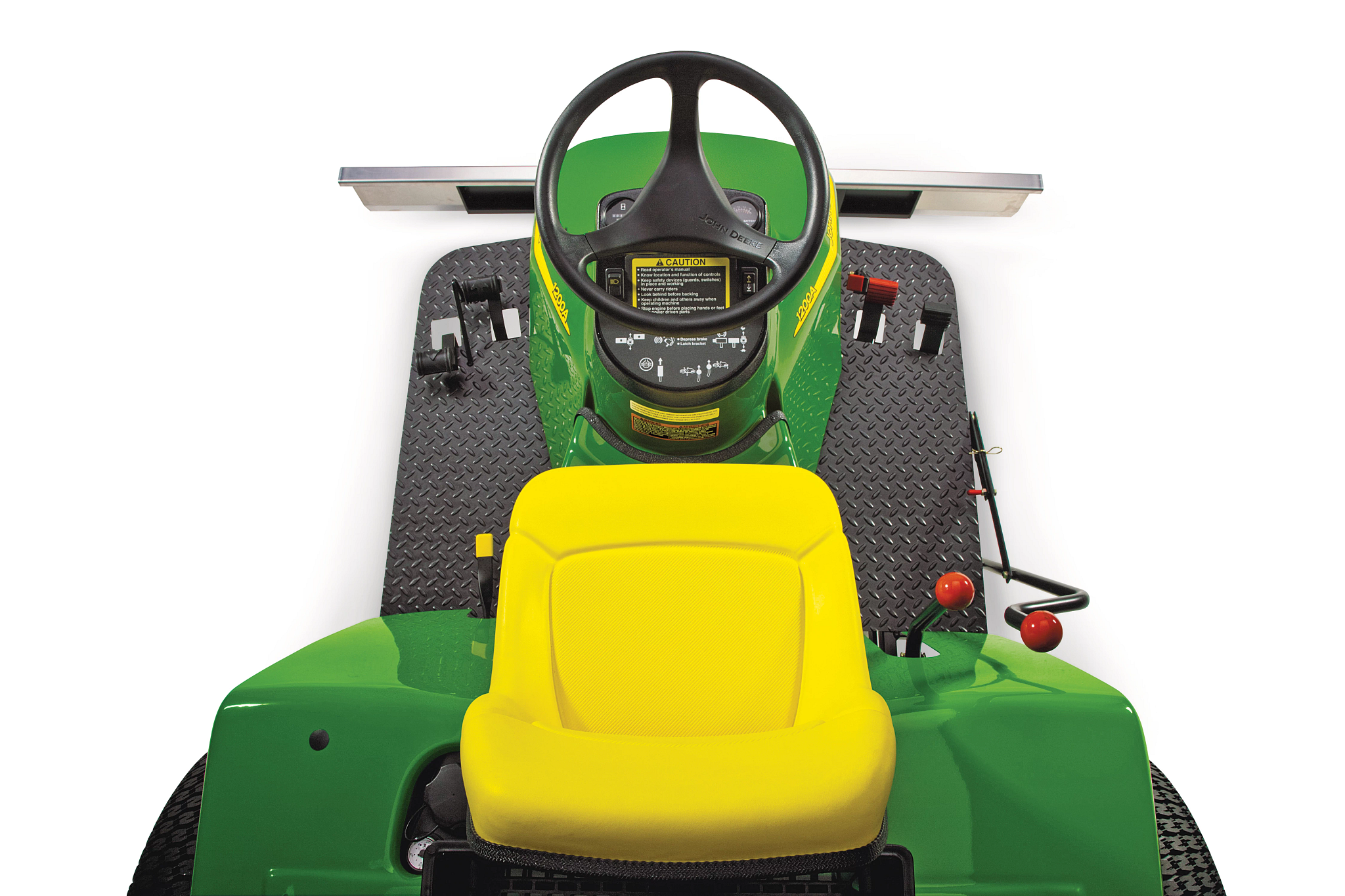 Top‑down view of a compact utility vehicle operator area showing the steering wheel, dashboard controls, foot pedals, textured floor mat, and a bright yellow seat.