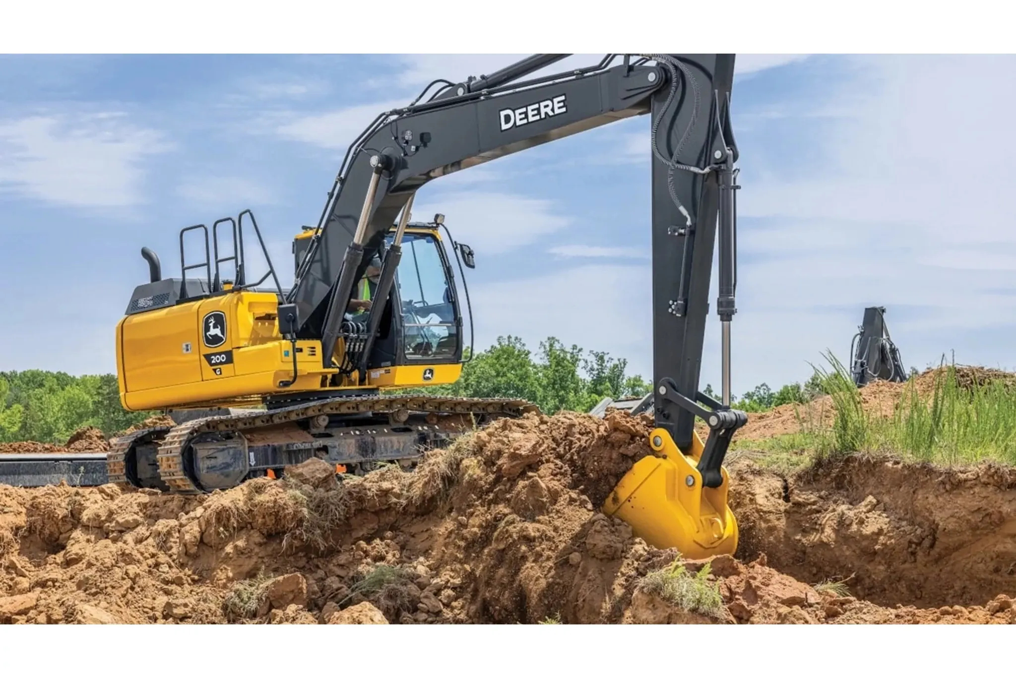 200G compact excavator digging a hole in the ground