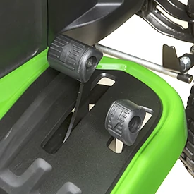 Top right studio view of an S100 series lawn tractor's two-pedal speed/direction controls