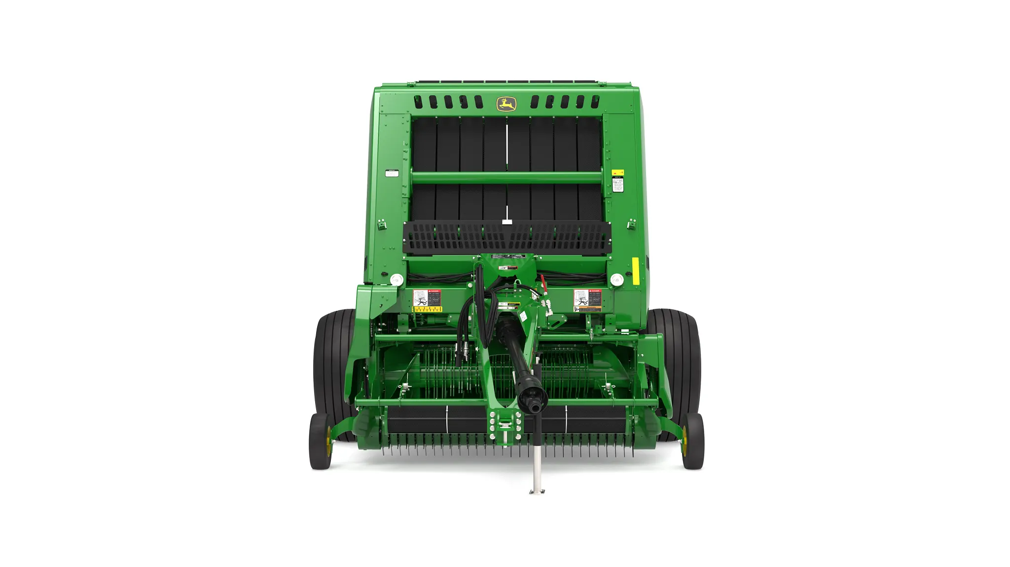 Front view of a John Deere 561R round baler with Precutter, showing the pickup reel, PTO hitch, bale chamber opening, large transport tires, and green-and-yellow branding on a white background