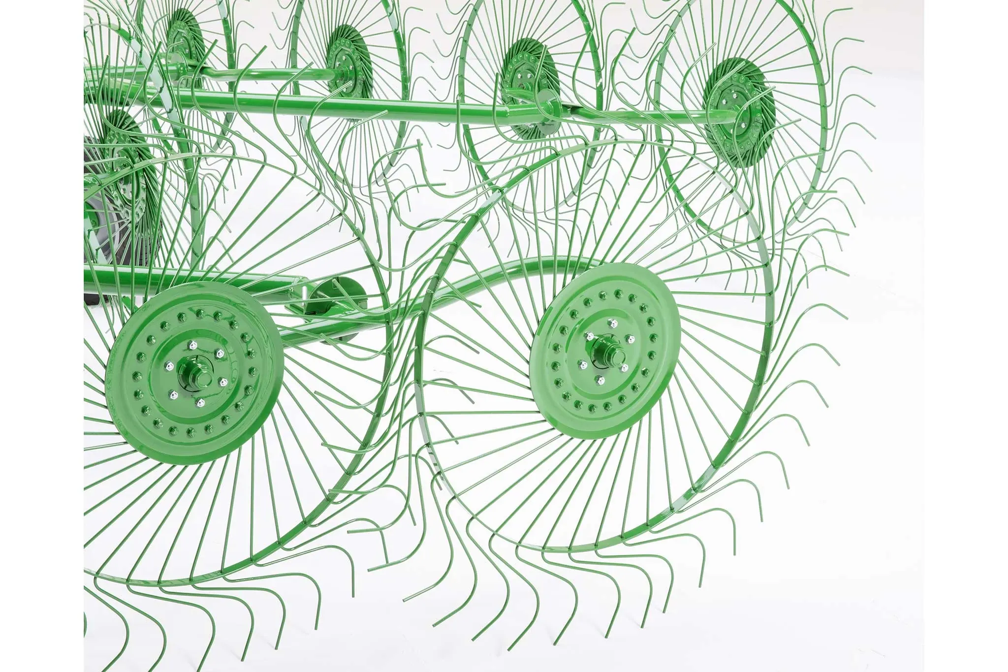 Studio close-up of the green circular rakes that comprise a WR00 Wheel Rake