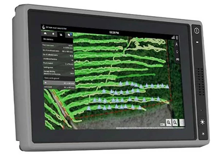 A rugged touchscreen monitor displaying a GPS field map with highlighted rows, guidance paths, and machine location