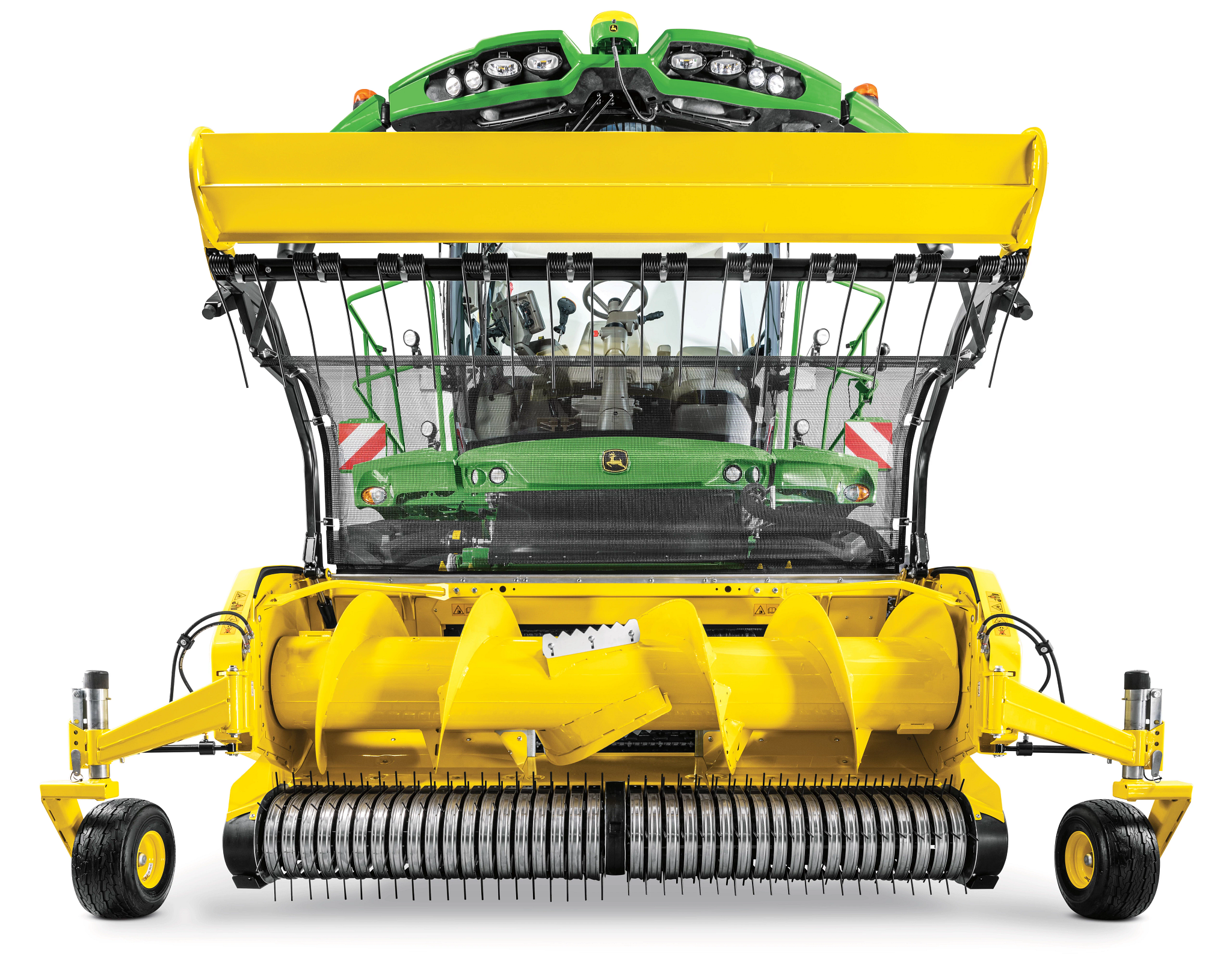 Front view of a forage harvester and its yellow pickup header, with trash net raised to show large auger. roller, and tines