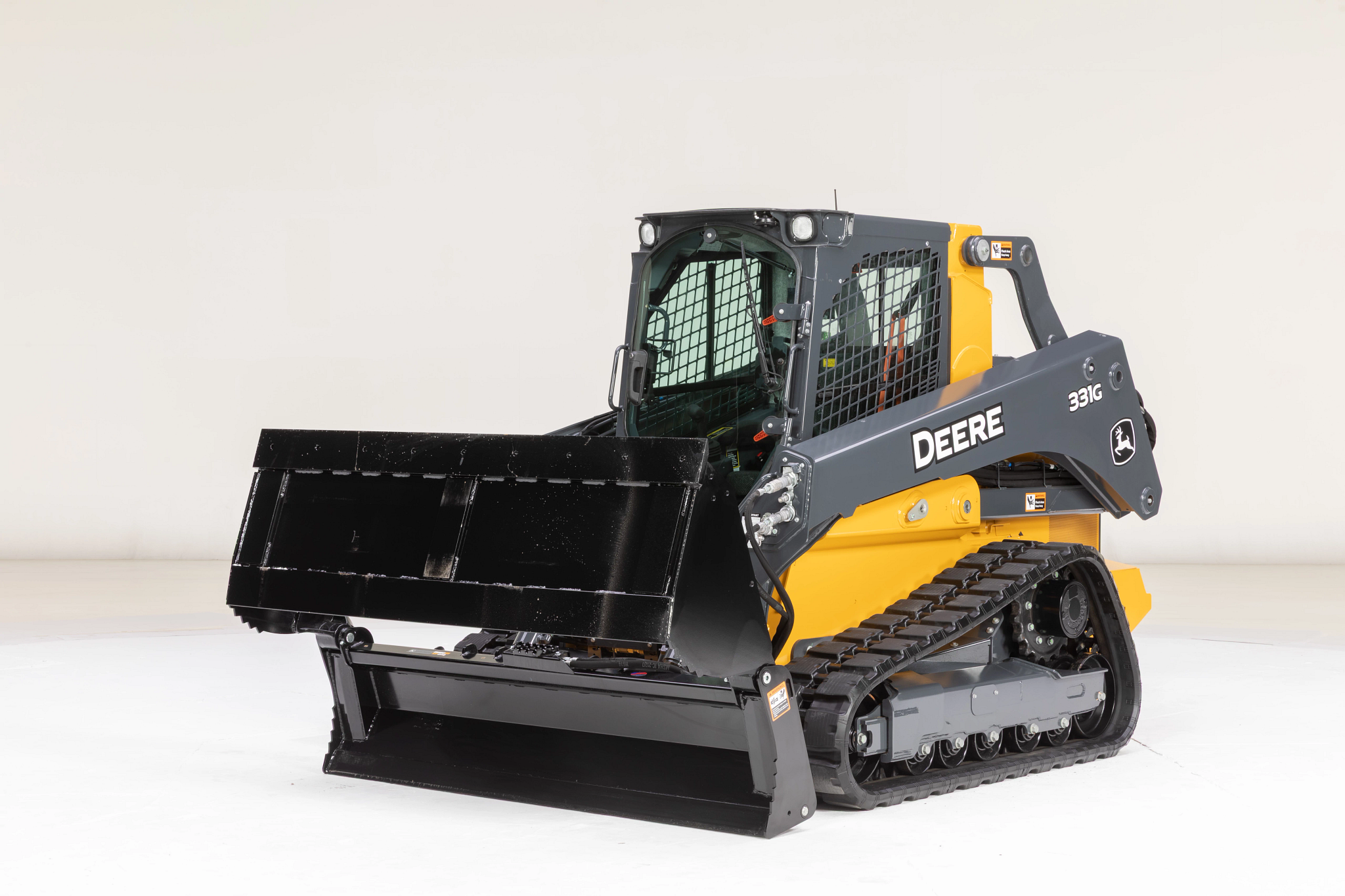 Front left studio view of a 331G compact track loader with MP84B multi-purpose bucket in open position