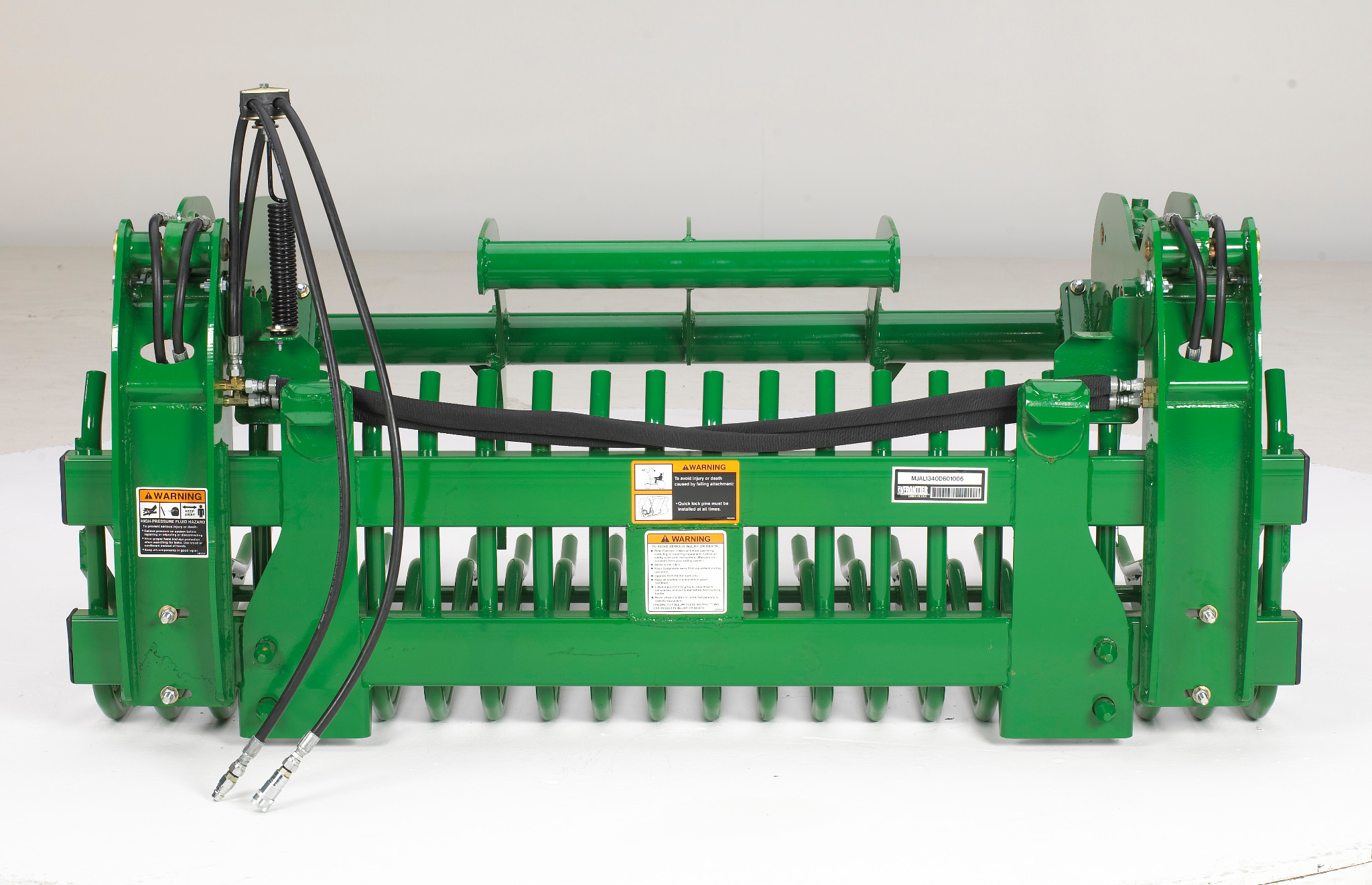 Studio view of the hydraulics on the bucket grapple field conversion kit for AR10 Rock Bucket