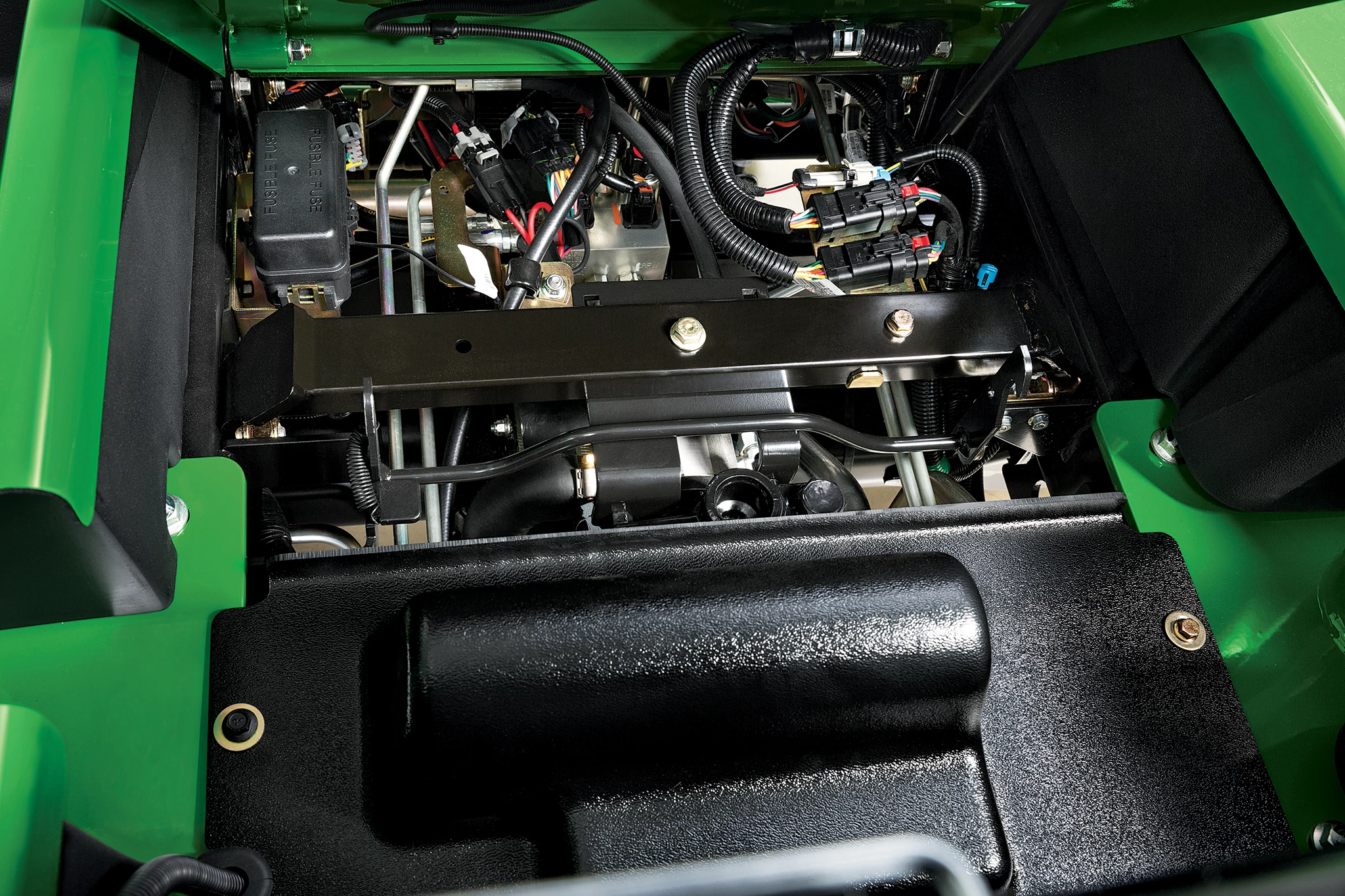 Studio close-up of a 7500A E-Cut Hybrid Fairway Mower's uncovered eHydro™ traction pump and wheel motors