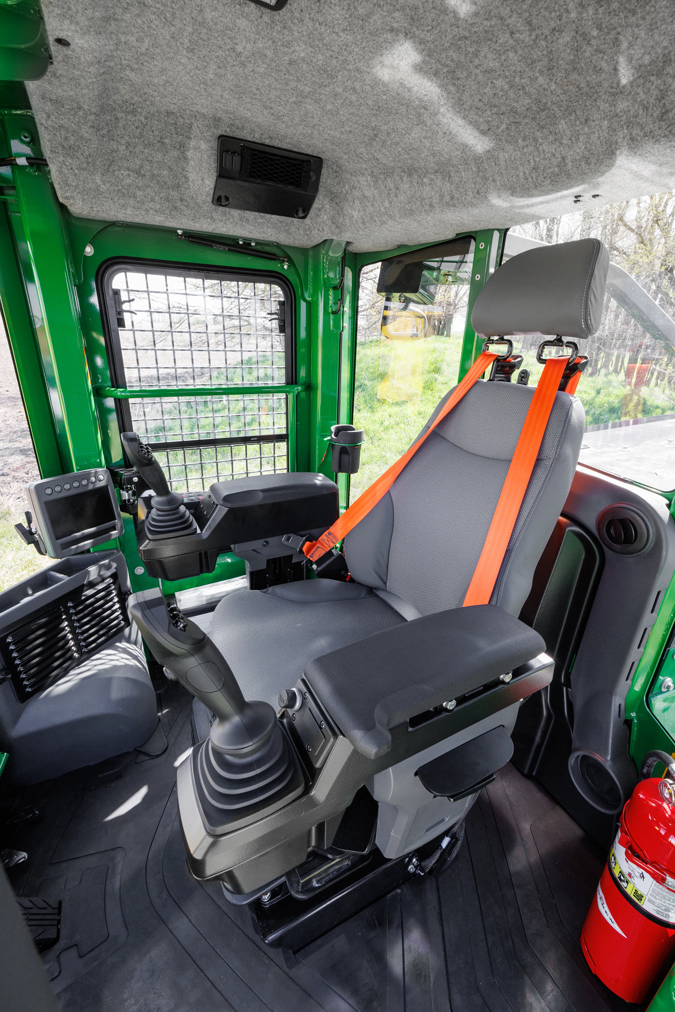 View of the 843L-II wheeled feller buncher cab interior upon entry