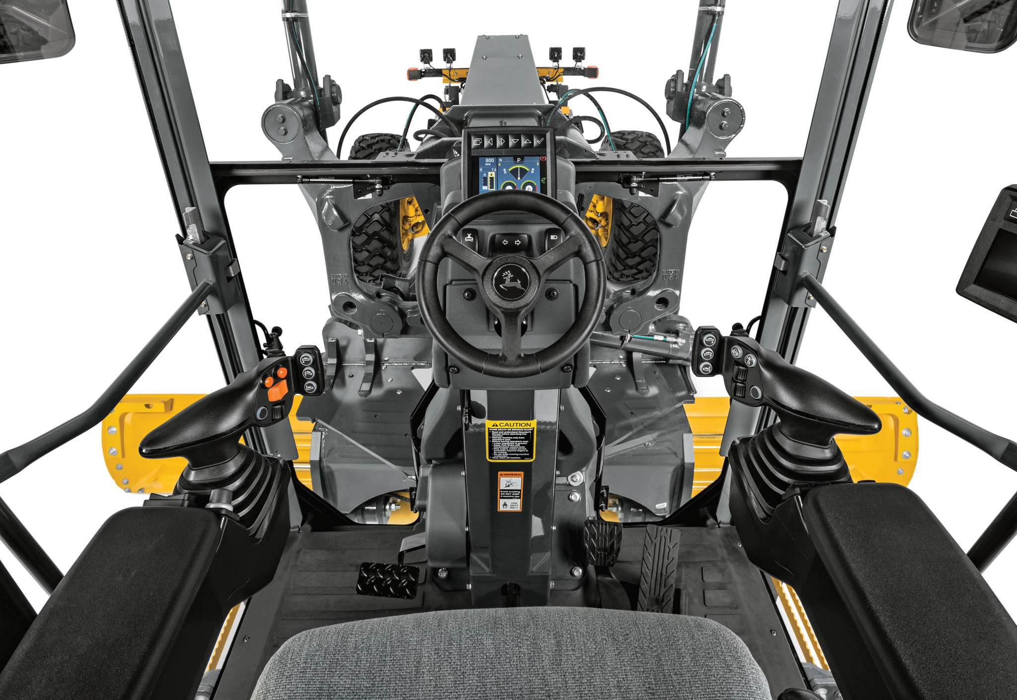 Front, in-cab view of P-Tier Motor Grader Dual Joystick controls and steering wheel