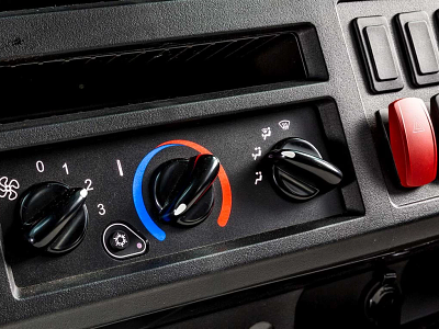 Detailed view of a gator dashboard showcasing a temperature control knob alongside a bright red button for functionality.