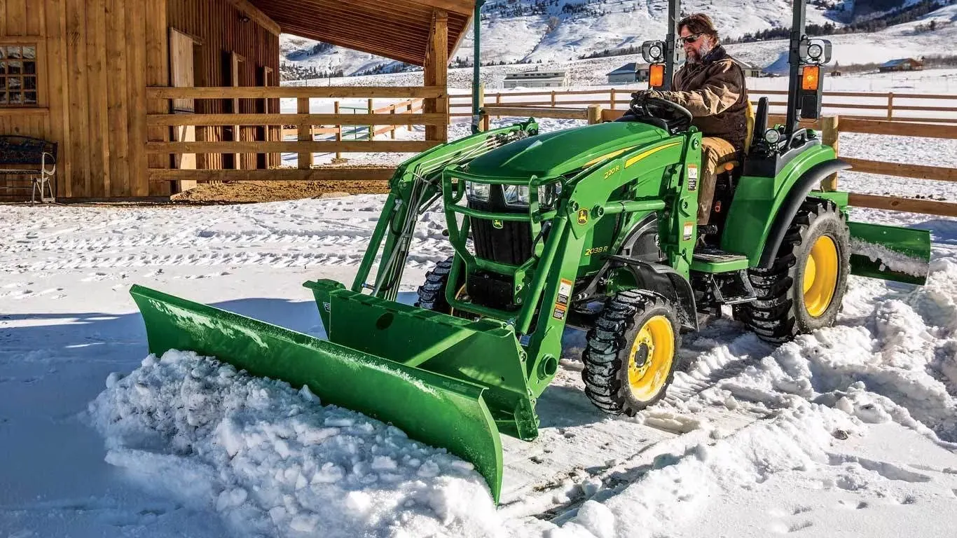 AF12D Series Front Blade clearing snow in an animal pen