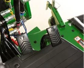 Studio close-up of a 1 series tractor's Twin Touch™ foot controls