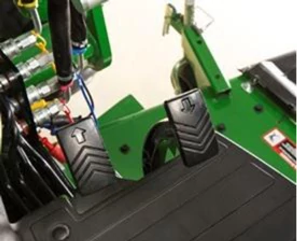 Studio close-up of a 1 series tractor's Twin Touch™ foot controls