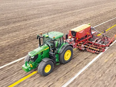 Digital projection of AutoTrac Implement Guidance Passive lines as a tractor pulls a tillage implement in the field