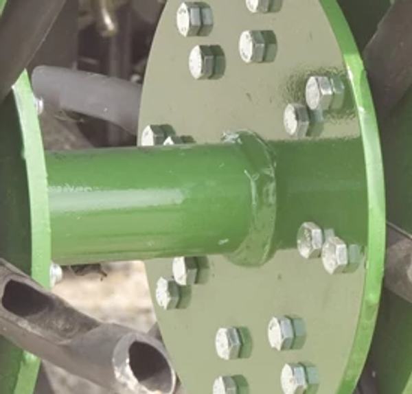 Close-up of the double bronze bushings on a green CS20 aerator rotor