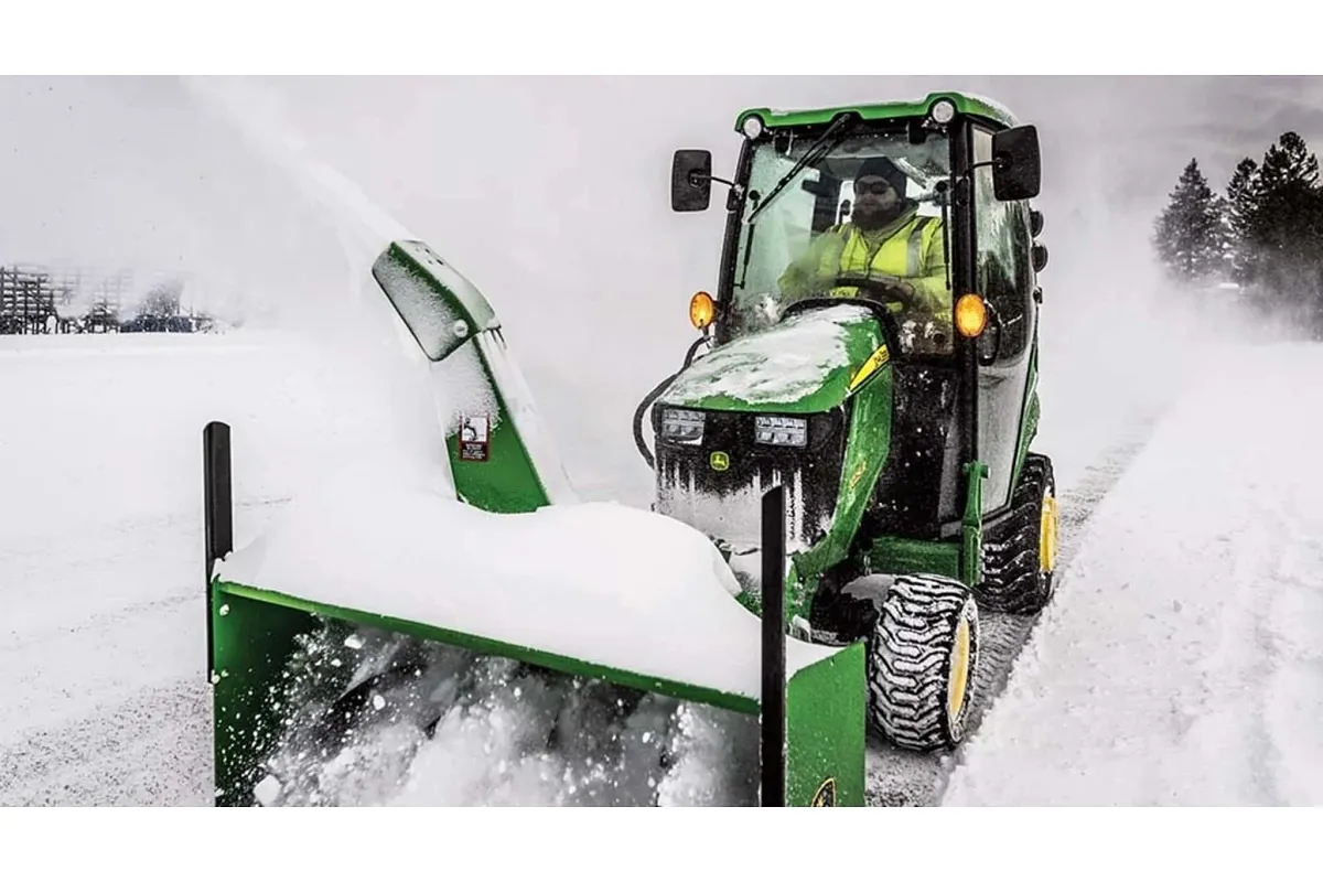 John Deere 1025R compact utility tractor on a residential property - Koenig Equipment