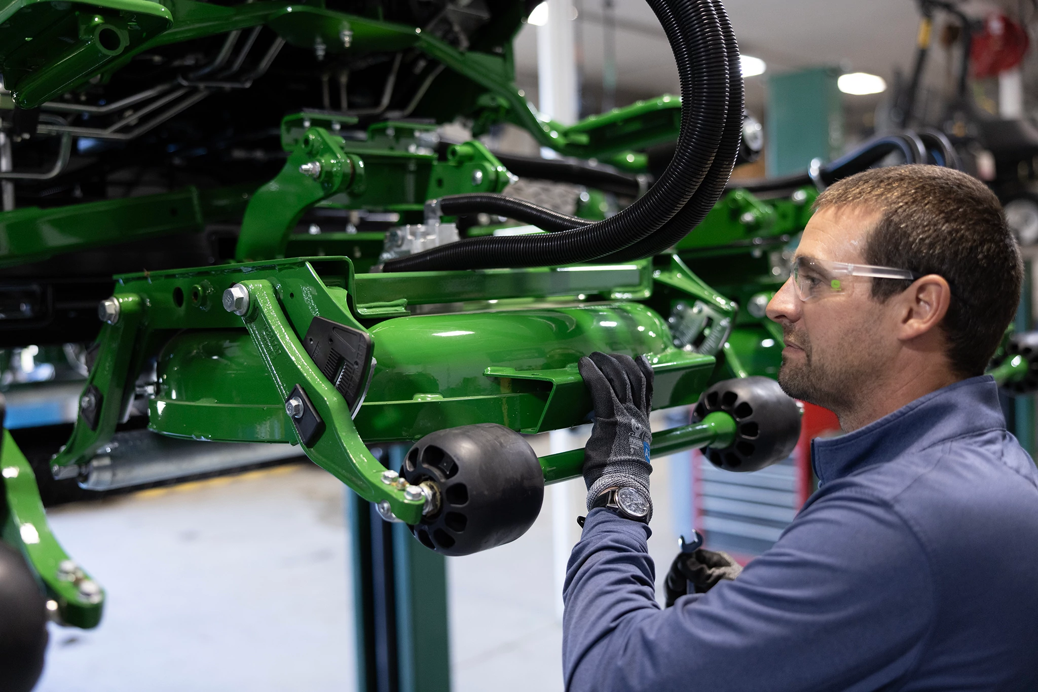 Service tech working on a 9009A TerrainCut mower deck