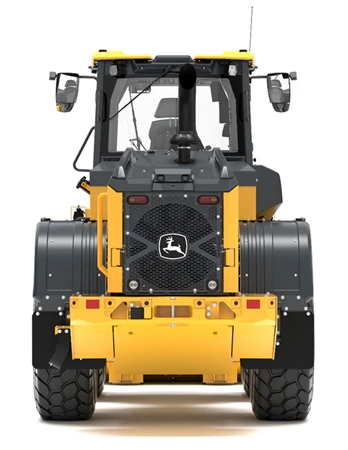 Rear view of a wheel loader, showing large treaded rear tires, enclosed operator cab with mirrors, central exhaust stack, and John Deere logo