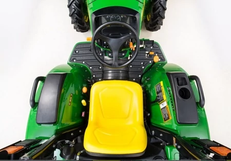 Top studio view of a 3-series compact utility tractor's clean, simple operator's station (seat, steering wheel, arms, back of front tires)