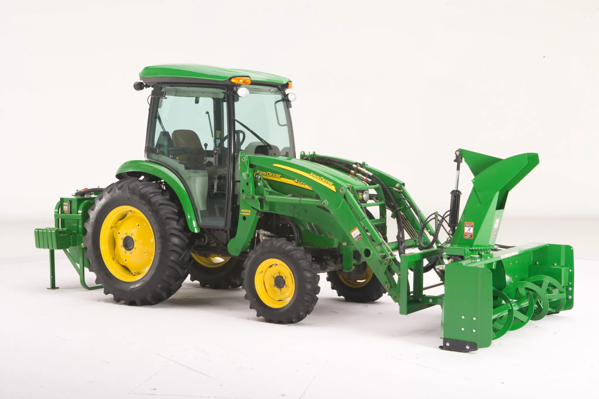 Studio view of 4720 Tractor with loader and SB2176 Snowblower