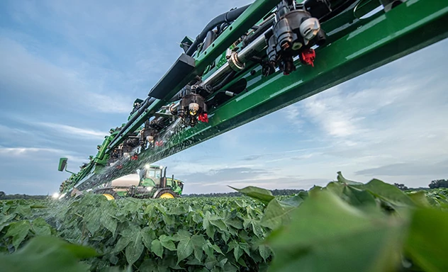 John Deere Sprayer in a field using ExactApply to spray crops