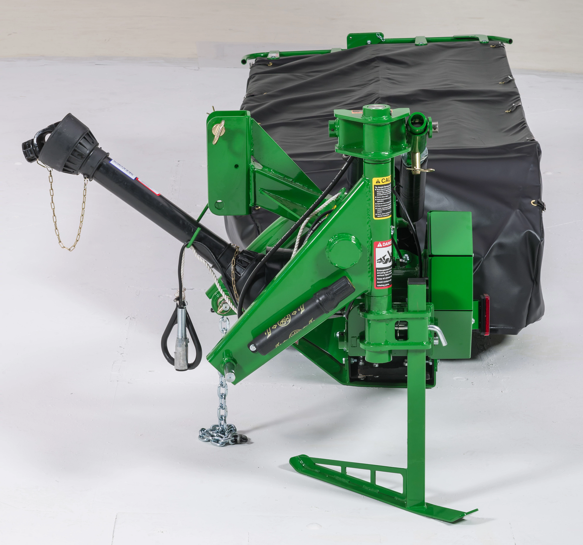 Front view of a DM5070 Disc Mower in studio parked on its stand with arm up