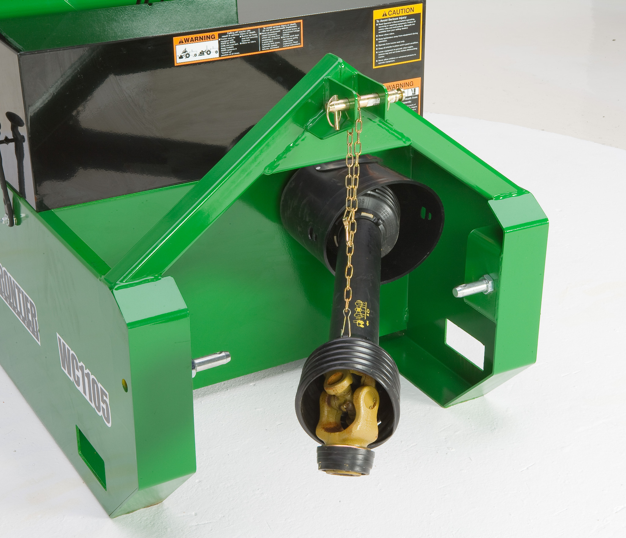 Close-up of WC1105 Wood Chipper showing showing a PTO driveline hanging from a chain