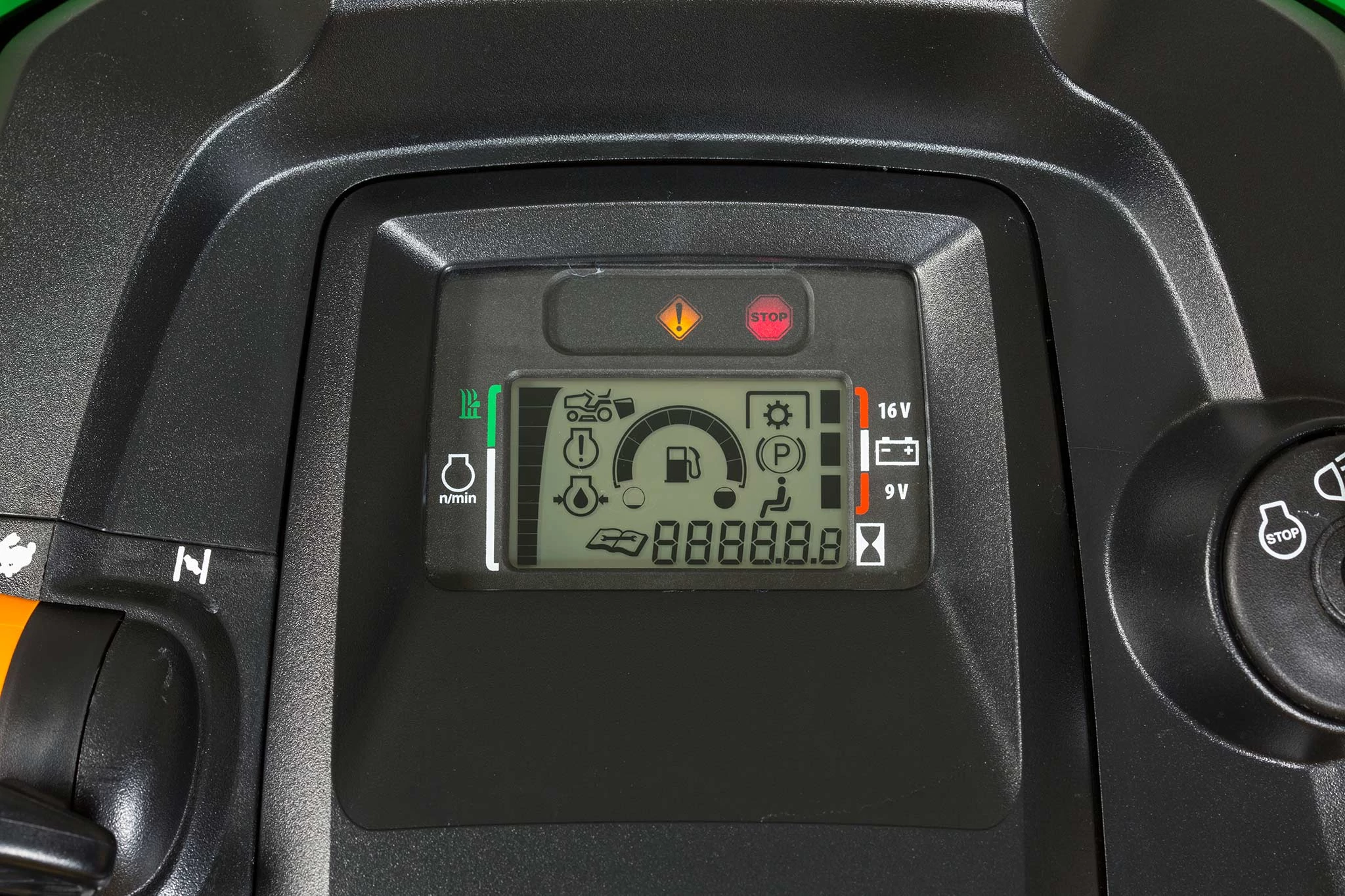 Close-up of an X330 lawn mower's black dash and diagnostic screen