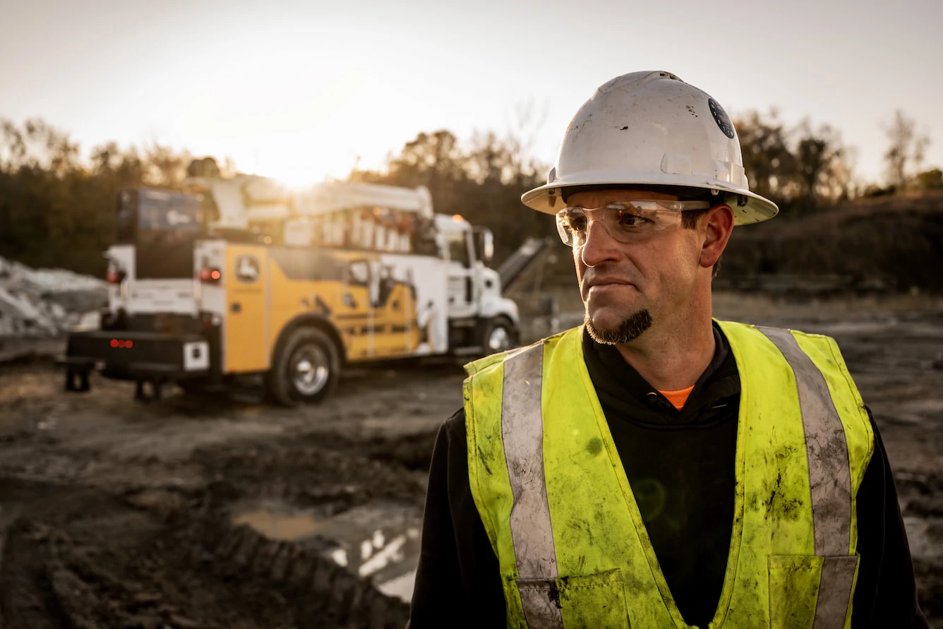 John Deere Service Technician on job site