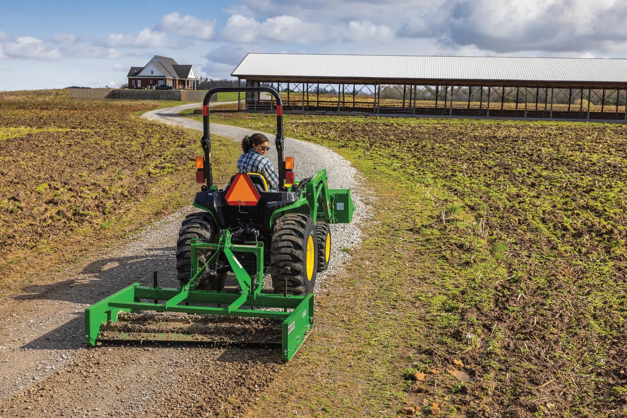 LP2172 Land Plane on 3038E Tractor grading gravel in field path