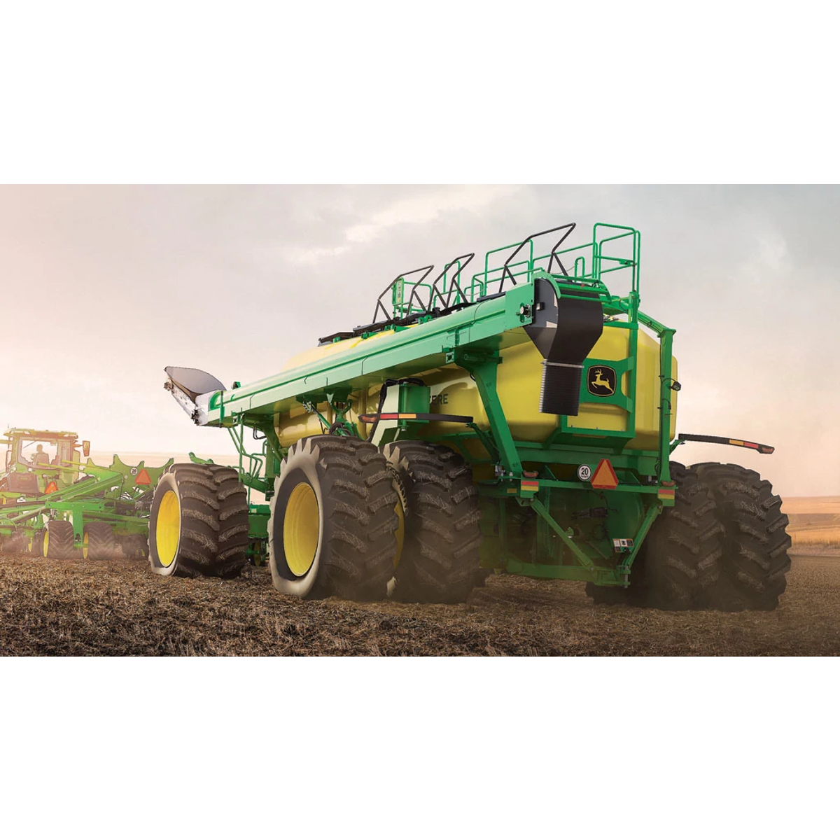 John Deere air cart and tractor working in the field — Koenig Equipment