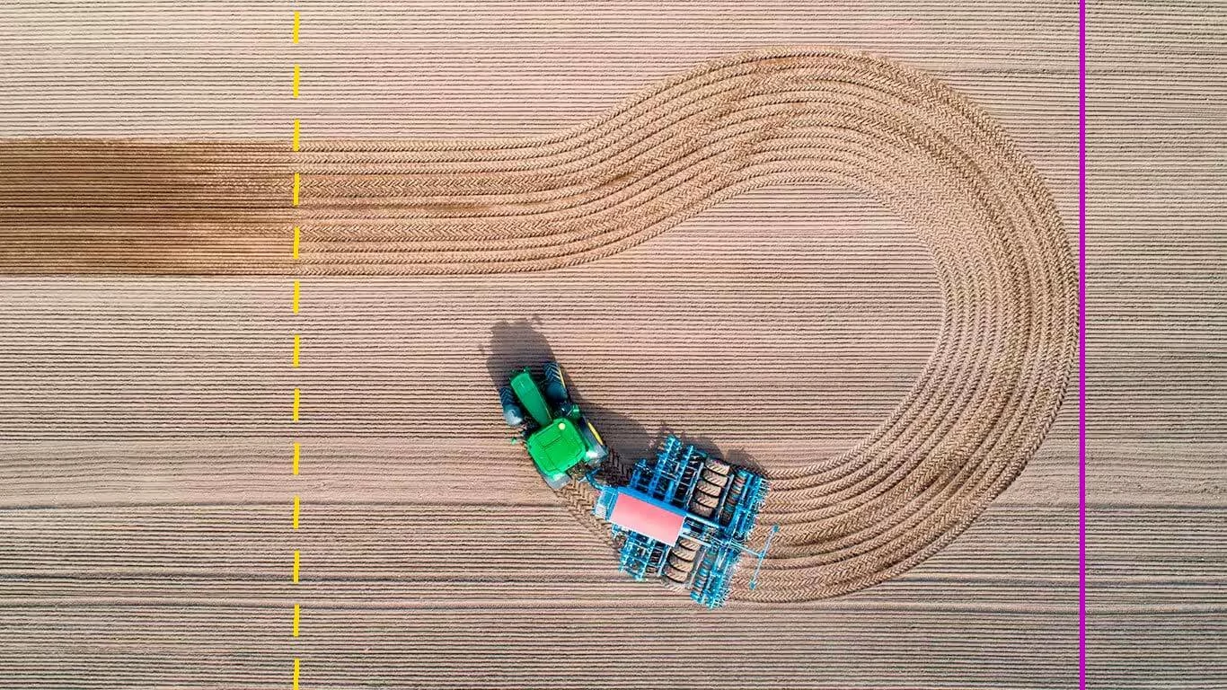 Digital projection of AutoTrac™ Turn Automation on an overhead view of a tractor and tillage implement in the field
