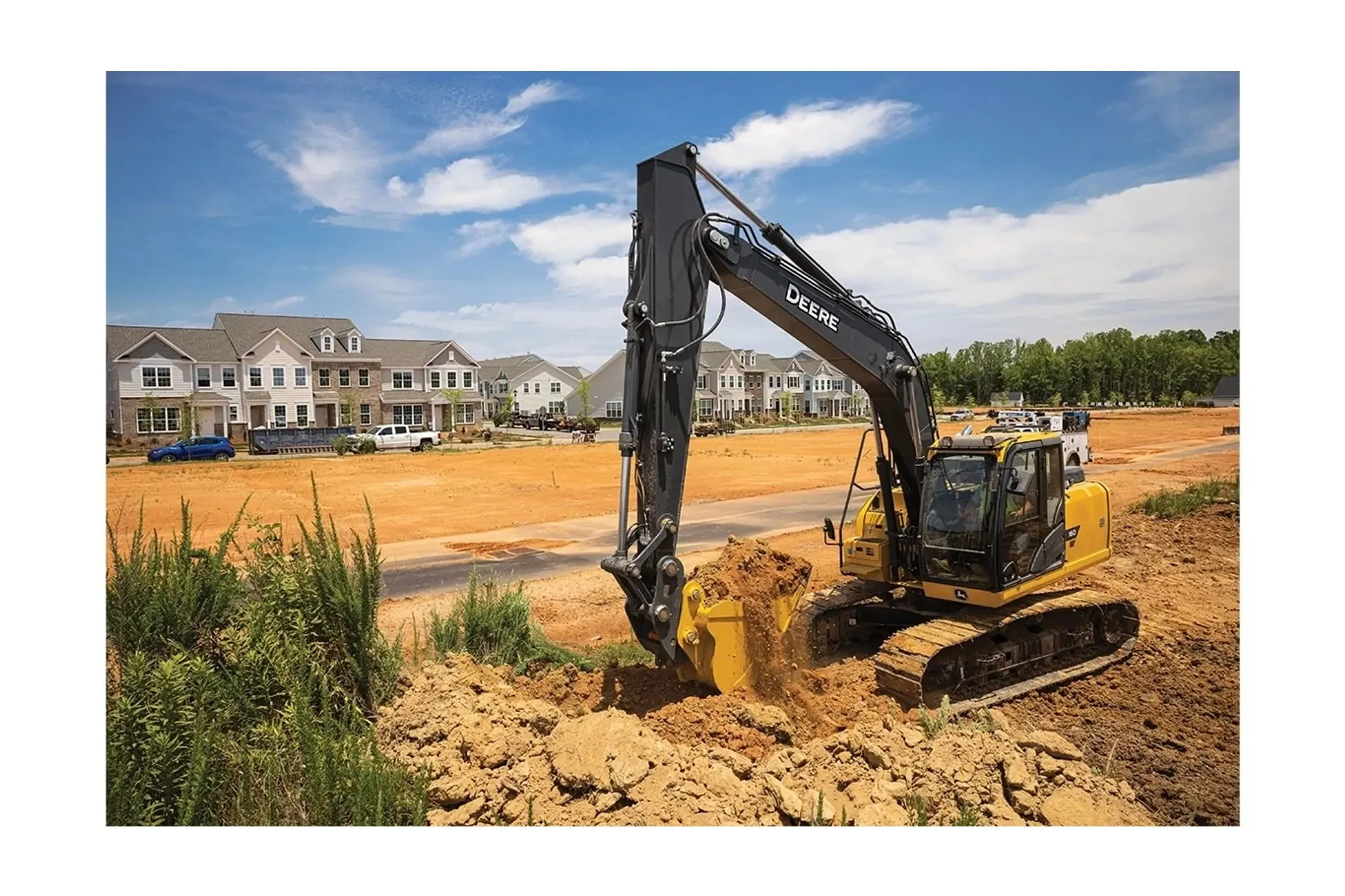1050P-Tier Large Dozer with a excavator digging dirt in front of a house
