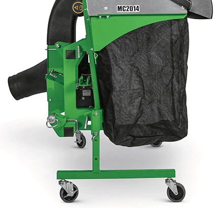 Rear-mounted material collection system featuring a green metal frame, black fabric collection bag, and airflow duct mounted on a wheels stand