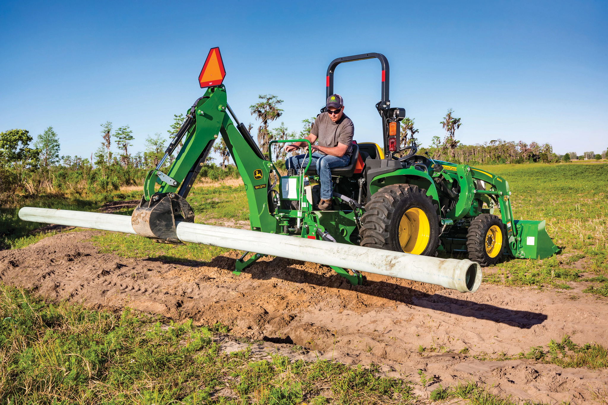 BH270 Backhoe working in field
