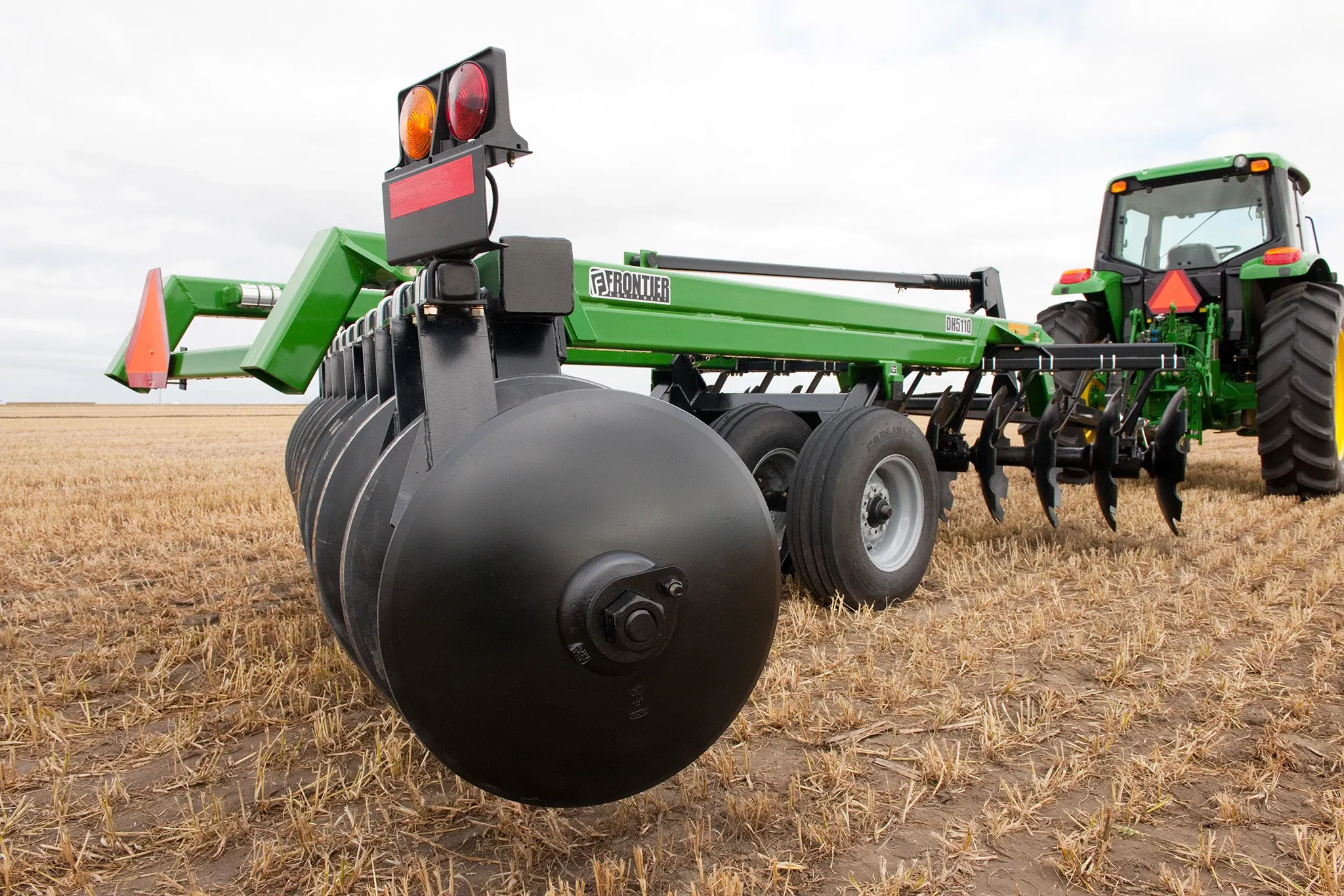 Close up view of DH5110 Disk Harrow on 7230 Tractor in field
