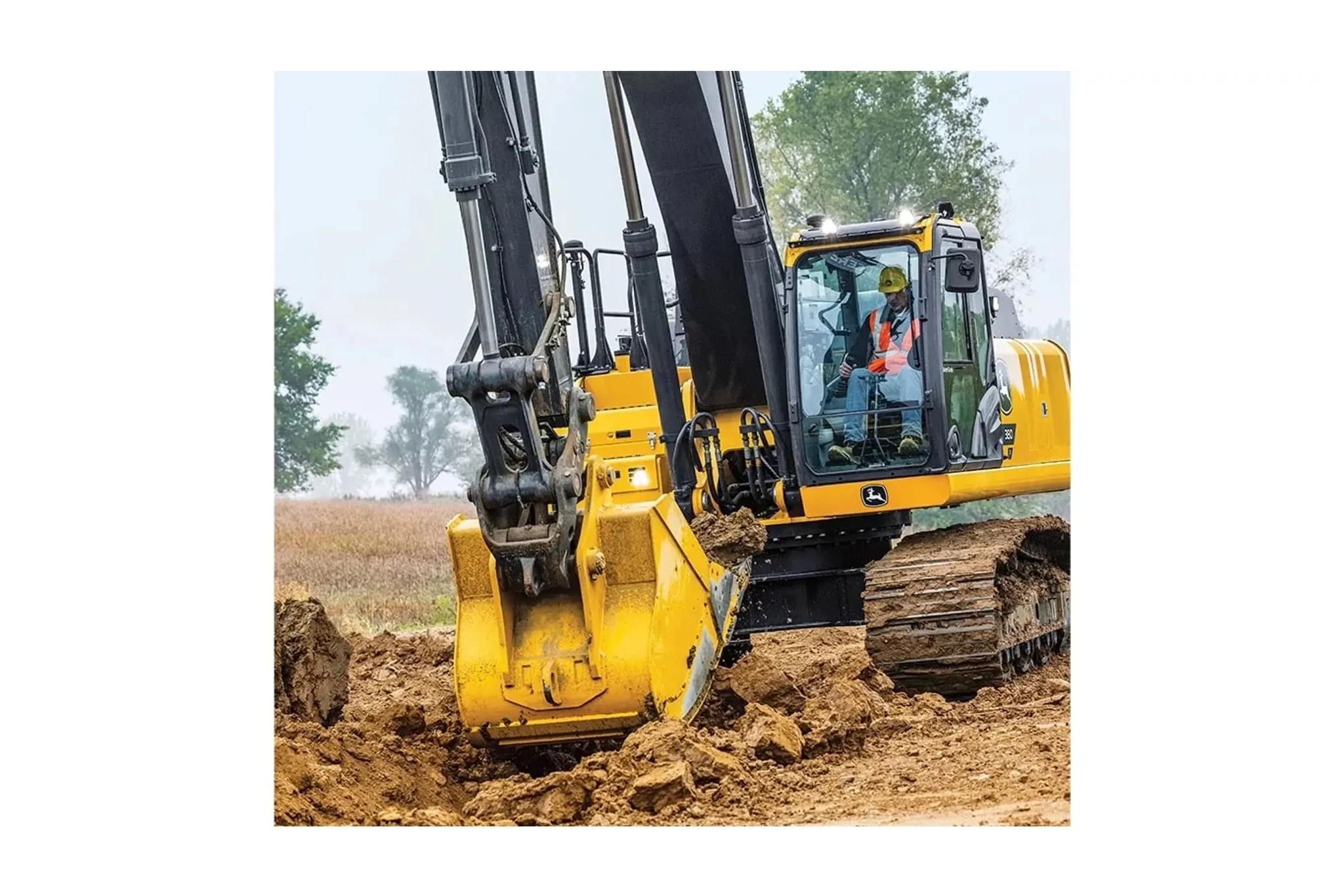 farmer operating a 380 P-Tier Compact Excavator in a dirt field
