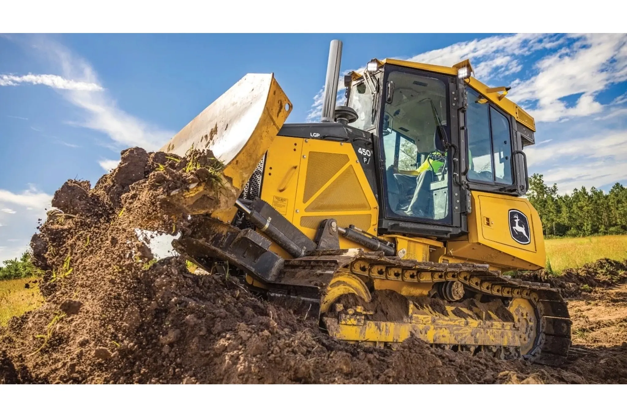 450 P-Tier filling a bucket from a dirt pile