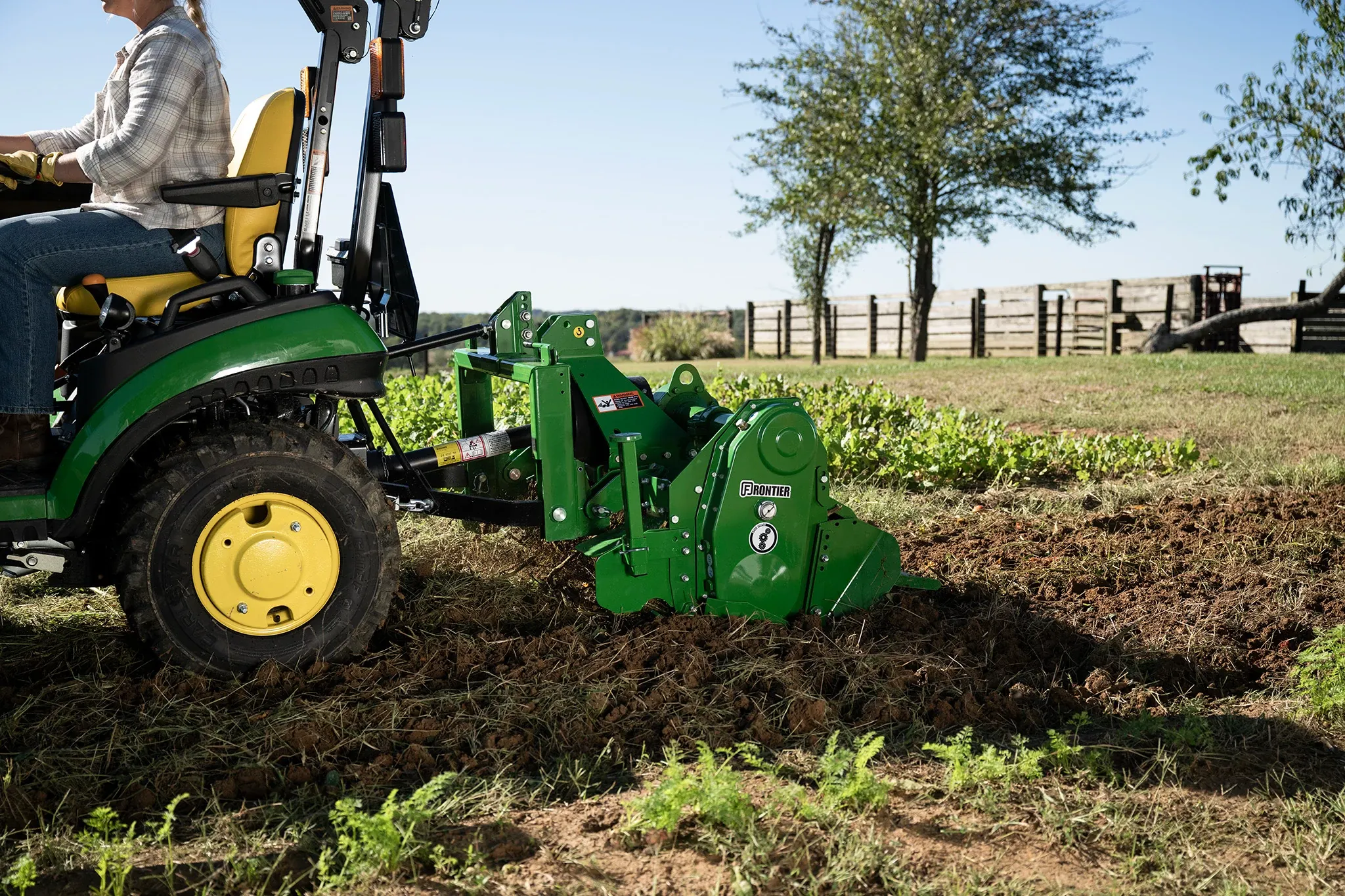 RT3049 Rotary Tiller tilling up dirt in a garden
