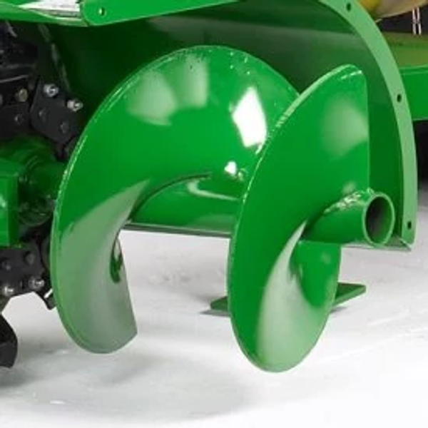 Studio close-up of the end of a DT11 series trencher's green discharge auger