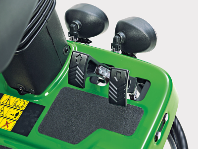 Close-up view of pedals on a fairway mower in studio