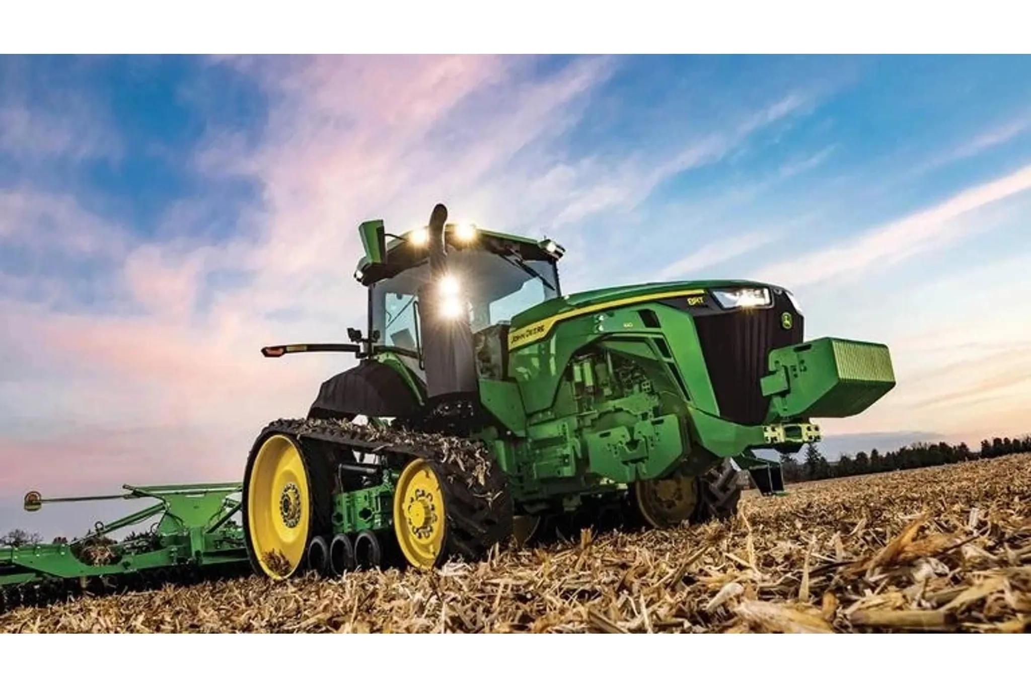 8RT 410 Two-Track Tractor with a tillage attachment in a harvested corn field