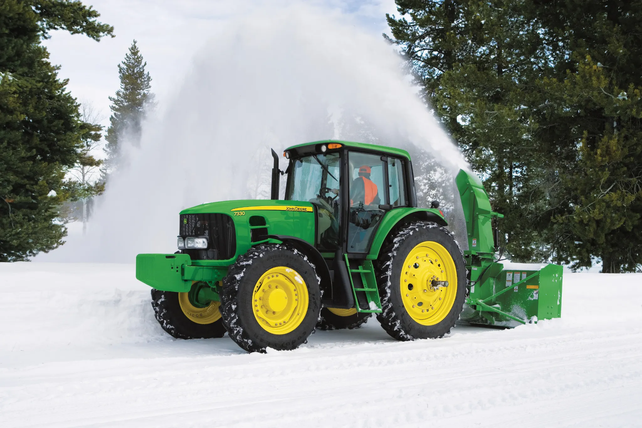 Blowing snow on a driveway using a SB1309R Snowblower on a 7330 Tractor