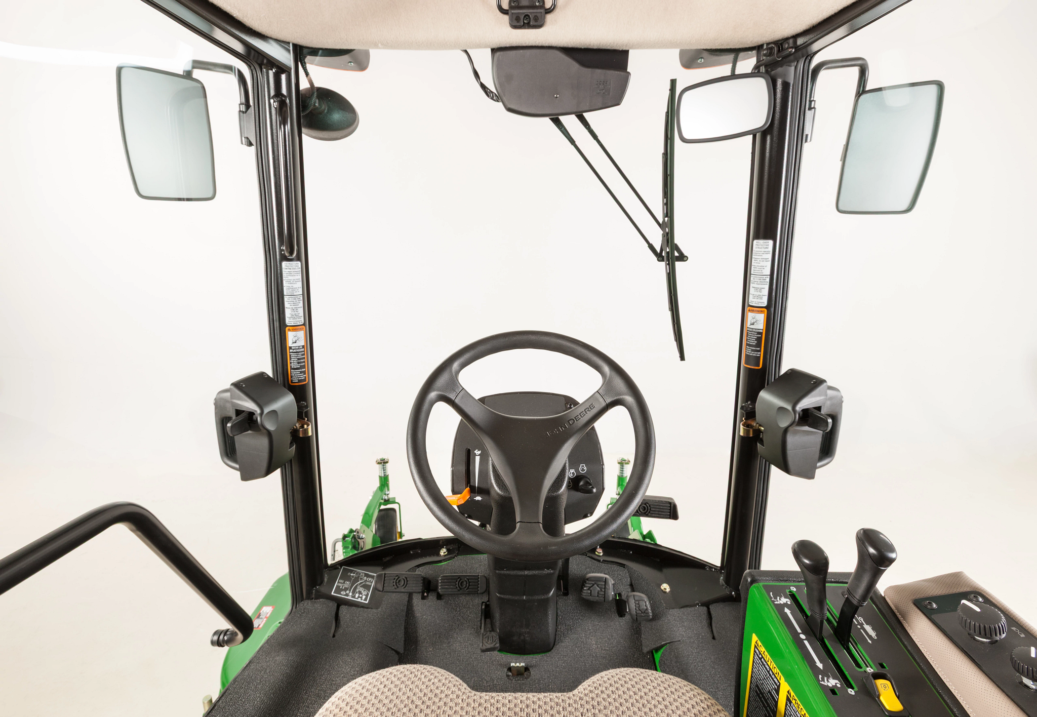 View of a TerrainCut™ Front Mower's cab from the operator's seat