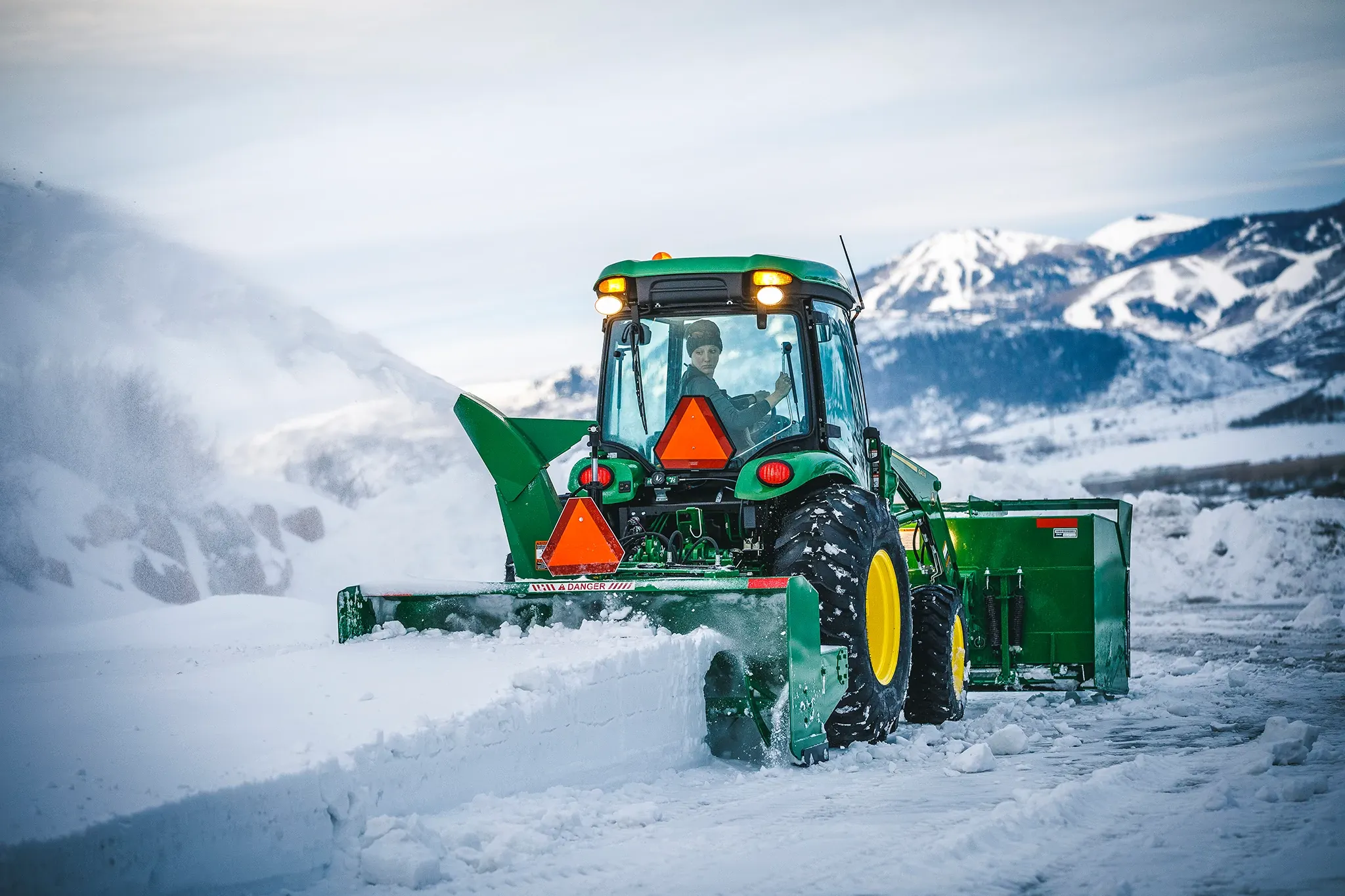 Operator moving snow with a SB1184 Snowblower on 4066R Tractor