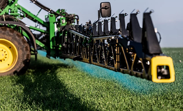 Close up view of a boom on a John Deere Sprayer with See and Spray technology