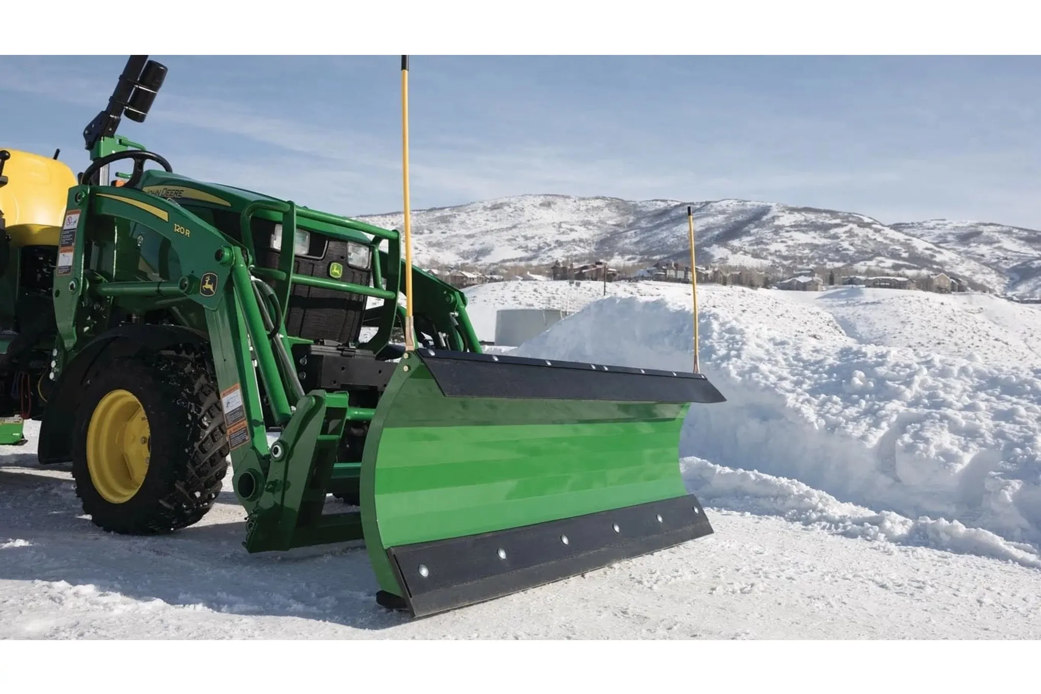 Front right view of AF10F Front Blade clearing snow from a driveway