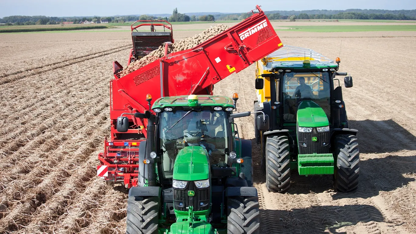 Front View of 850XZ Field Tractors harvesting potatoes in the field