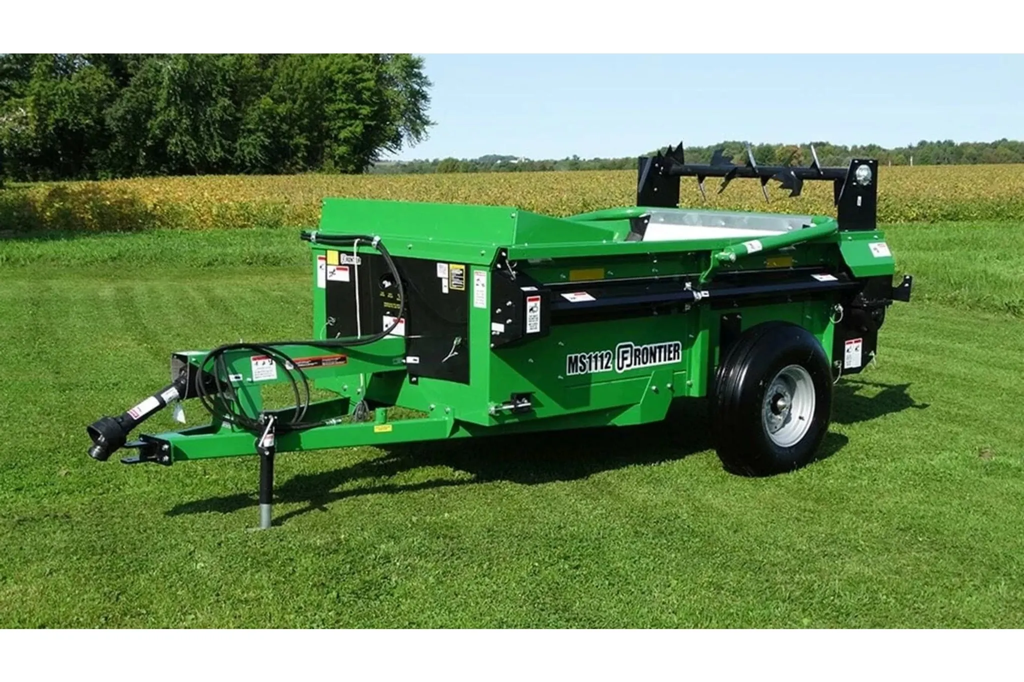 Frontier MS11 Manure Spreader attachment on a field of grass