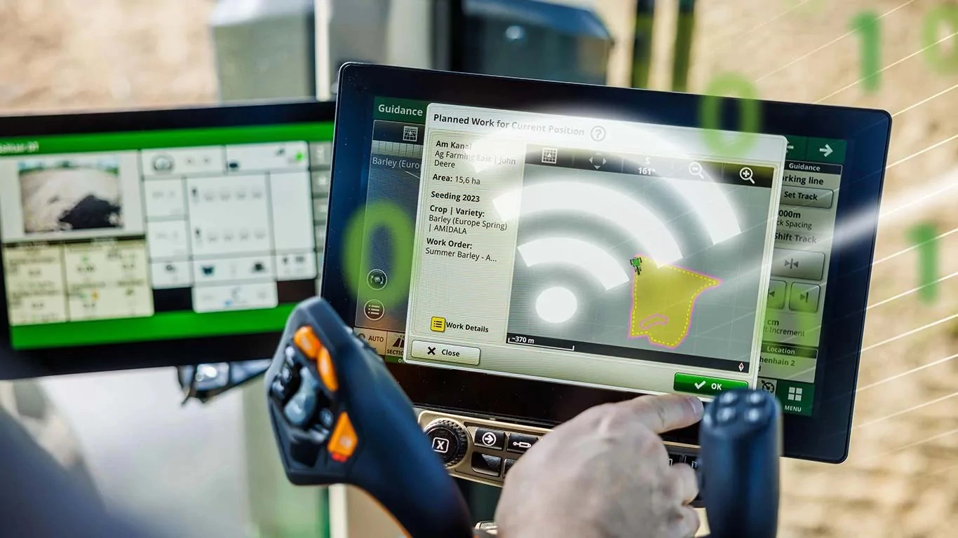 Hand points to monitors in cab displaying Operations Center
